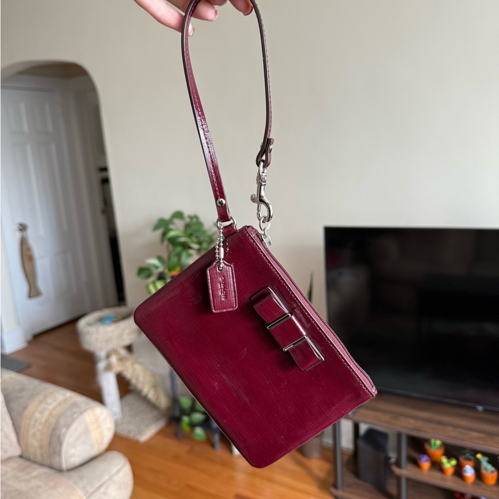 Elegant Coach Burgundy Patent Leather Wristlet